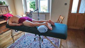 Muscular injury treatment being carried out at my Corsham Shiatsu and Acupuncture Clinic:- The patient is being treated with Acupuncture together with an infa-red heat lamp, which helps speed up the healing process